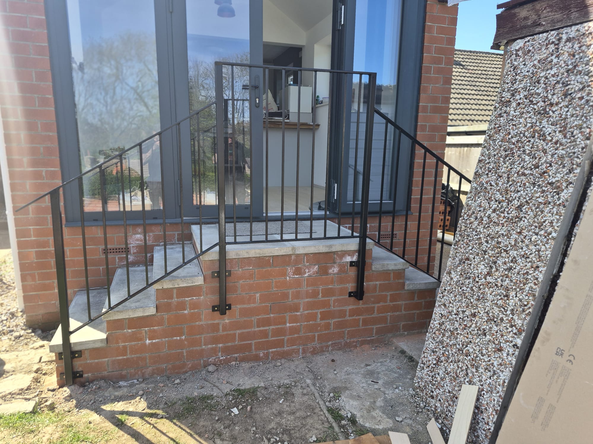 finished black security railings fitted to front steps